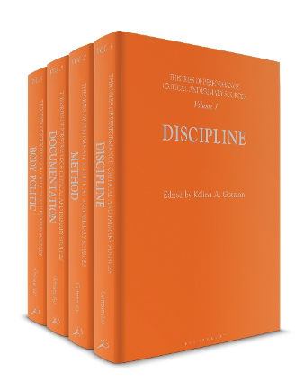 An image of the four volumes of the Theories of Performance collection, edited by Kélina Gottman. The Four books are in hardback, with orange fabric covers. The books are rotated so that the spine of all four volumes is visible, but only the front cover of Volume 1 is visible. The volumes are 'Body Politic', 'Documentation', 'Method', and 'Discipline'.